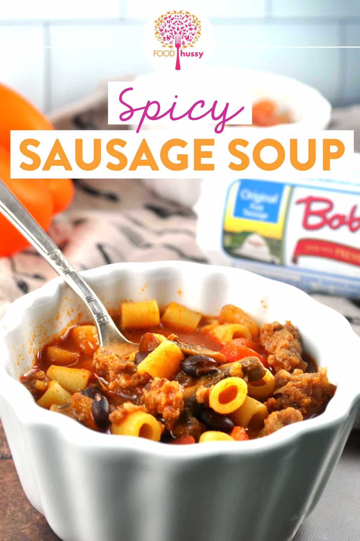 This Spicy Sausage Soup is hearty and full of vegetables and it's also SUPER HEALTHY!! It's the taste of comfort food in a bowl with pork sausage, tomatoes, onions, peppers, mushrooms and my favorite pasta! via @foodhussy