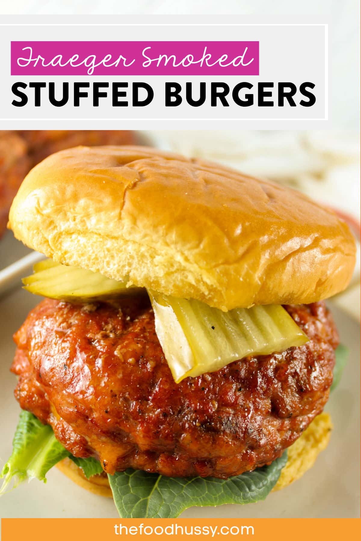 These Traeger Smoked Stuffed Burgers are the best burgers I've had! A delicious burger with simple seasonings and a perfect smoke ring - filled with cheddar cheese, smoky bacon and caramelized onions! via @foodhussy