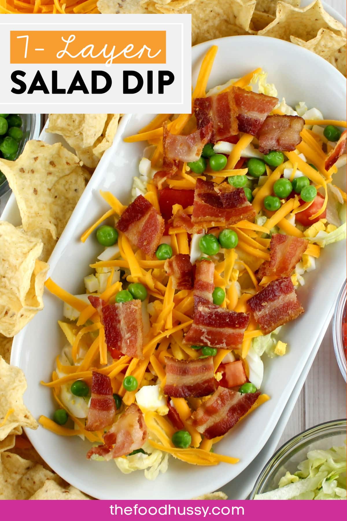 Seven Layer Salad Dip is a great and easy party appetizer! You just take all the things you love about the salad - but make it into a dip! Grab those scoops chips and dig in - it tastes just like the traditional 7 Layer Salad! via @foodhussy