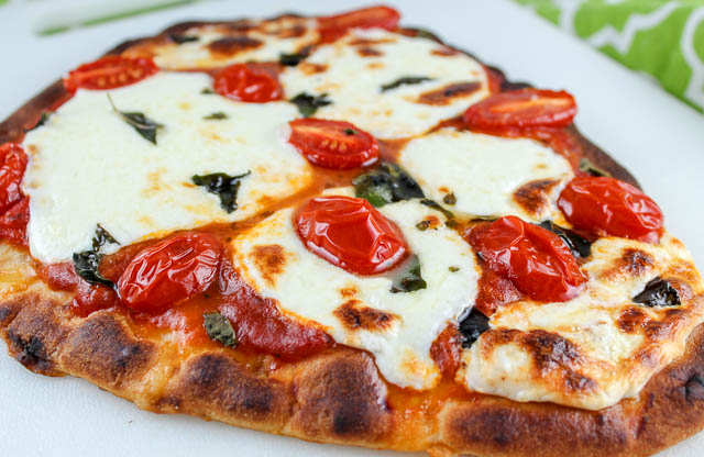 Neapolitan Margherita Pizza is the epitome of freshness! But this is the quick and easy way to make it - we take a shortcut with naan flatbread but still use fresh tomatoes and fresh mozzarella!