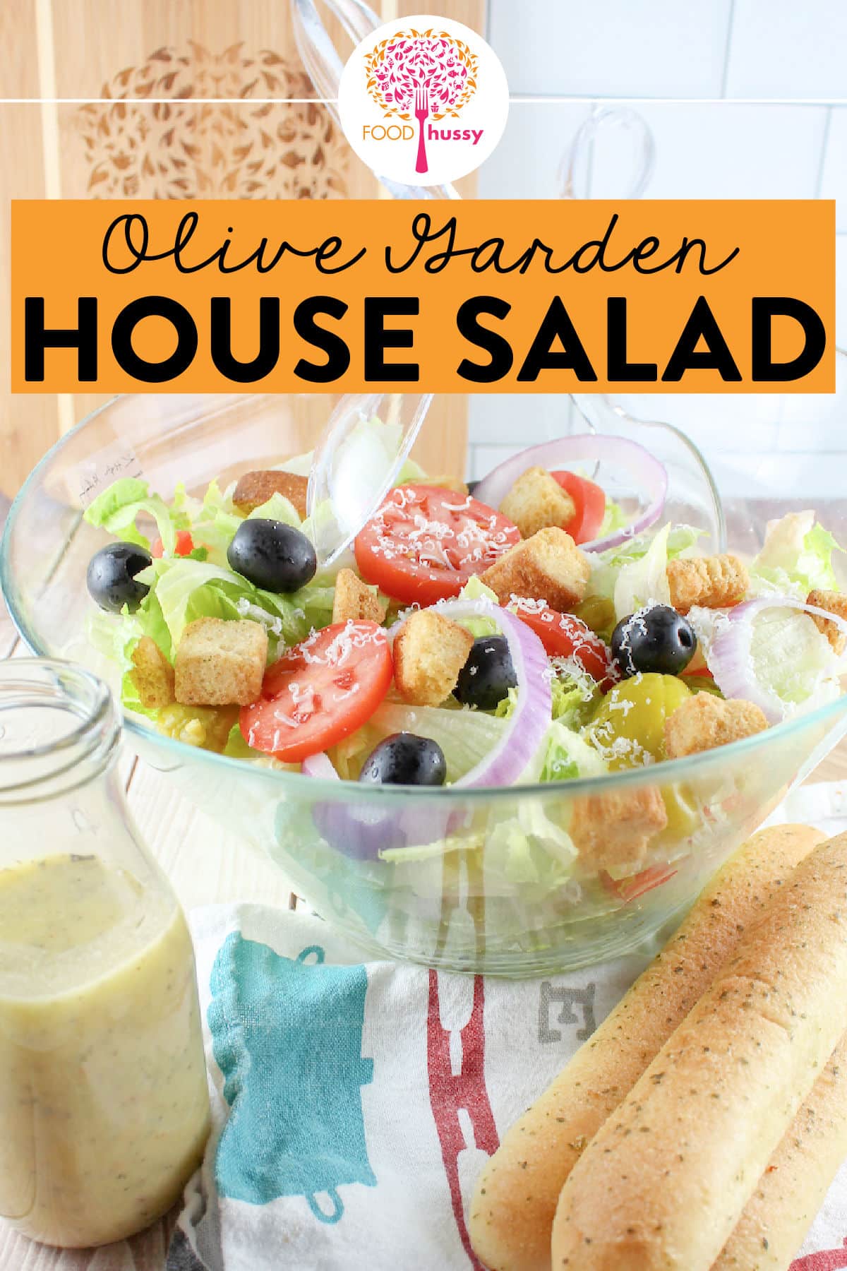 Olive Garden House Salad is literally the best restaurant salad! It has all your favorite toppings like olives and tomatoes and topped with that delicious and tangy dressing and I have the recipe to share with you! via @foodhussy