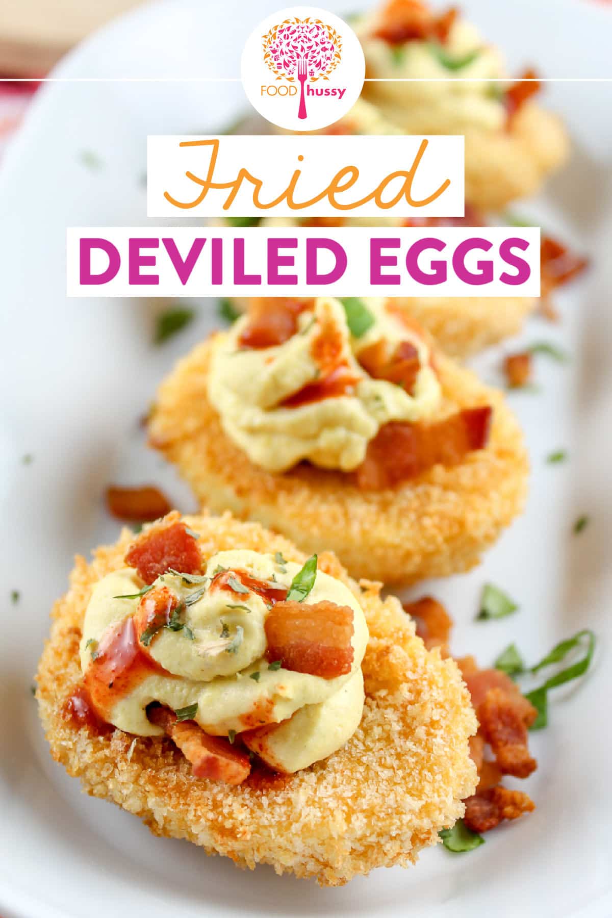 Fried Deviled Eggs are a unique way to make this delicious family-favorite appetizer! I had these in Atlanta - the egg whites are breaded and fried - the filling is topped with bacon and hot sauce. I made these Fried Deviled eggs in the air fryer because it makes them a little healthier (and tastes even better than the originals)! 
 via @foodhussy