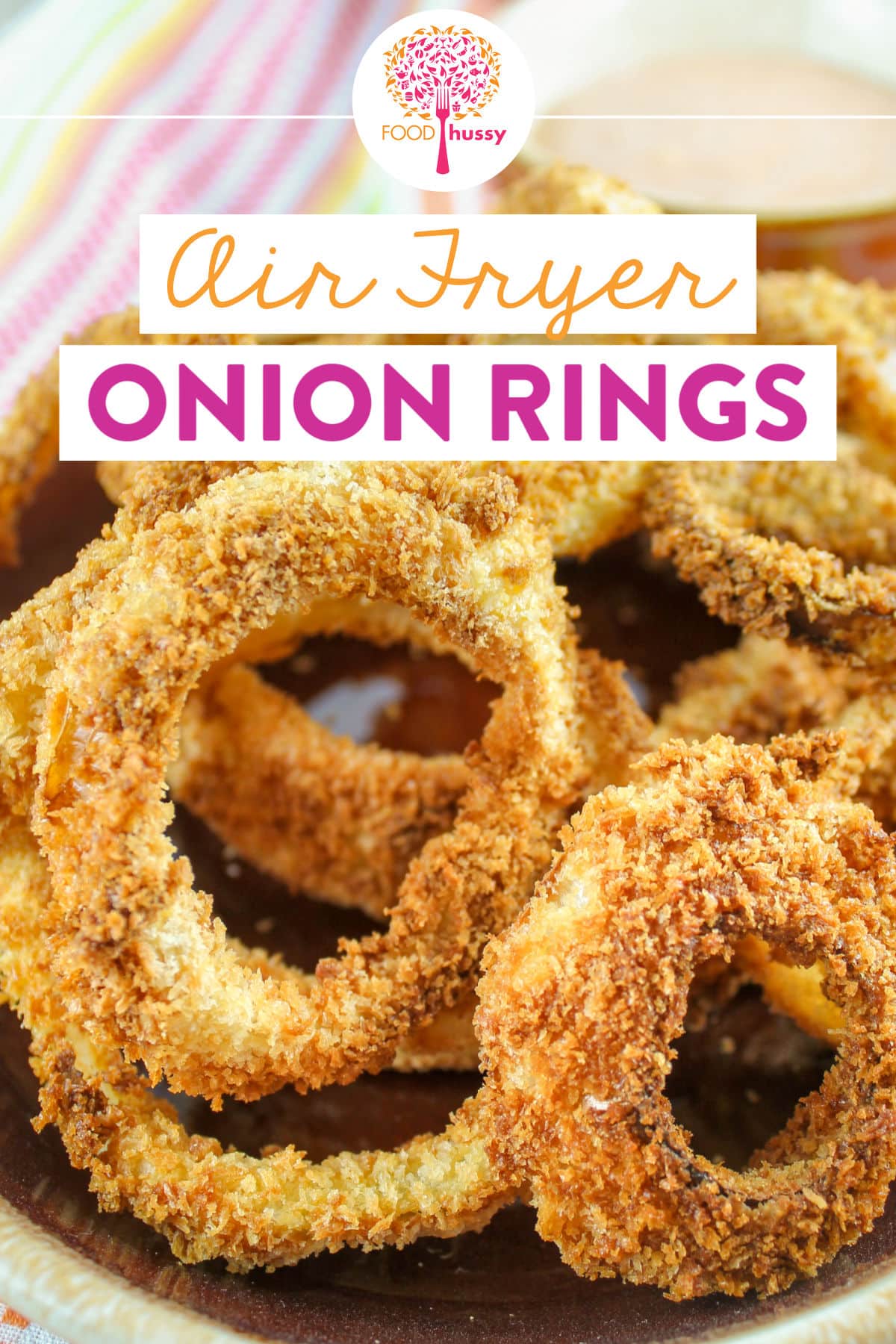 Homemade onion rings in the air fryer are amazing! You can't beat the crispness of these - plus I've got a secret ingredient for more flavor! And I made a fun zingy dippin sauce to go with the air fryer onion rings! Crunchy & saucy! Yum! via @foodhussy