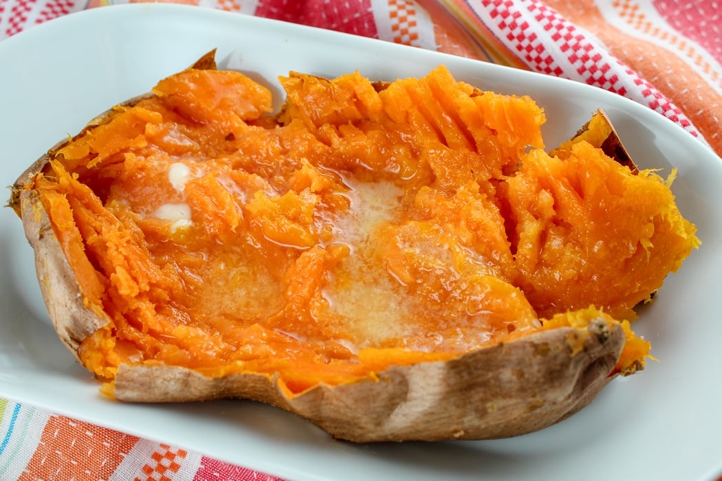 Air Fryer Baked Whole Sweet Potatoes are my new favorite side dish! I love a sweet potato but hate waiting an hour for them to get done in the oven - but now - 25 minutes in the air fryer!