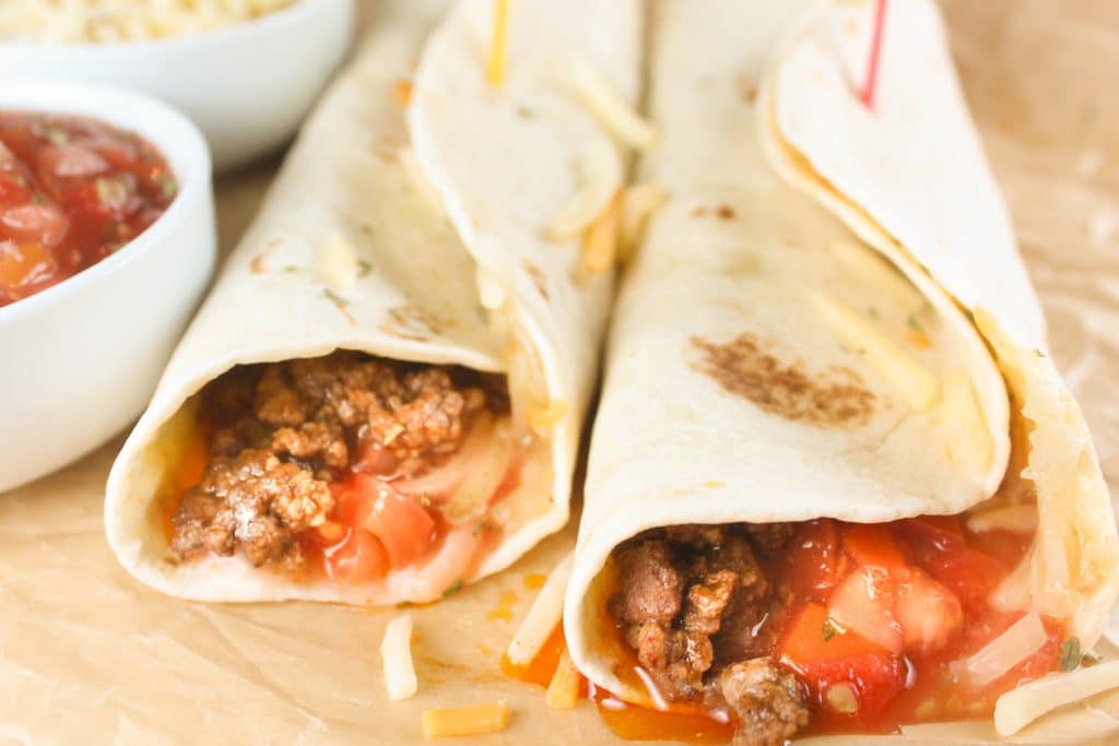 The Meximelt at Taco Bell was one of my absolute favorite menu items - but it's no longer on the menu! Ugh - the tragedy! This Copycat Taco Bell Meximelt brings it back to your kitchen by combining a taco and a quesadilla into a melty burrito of goodness. 