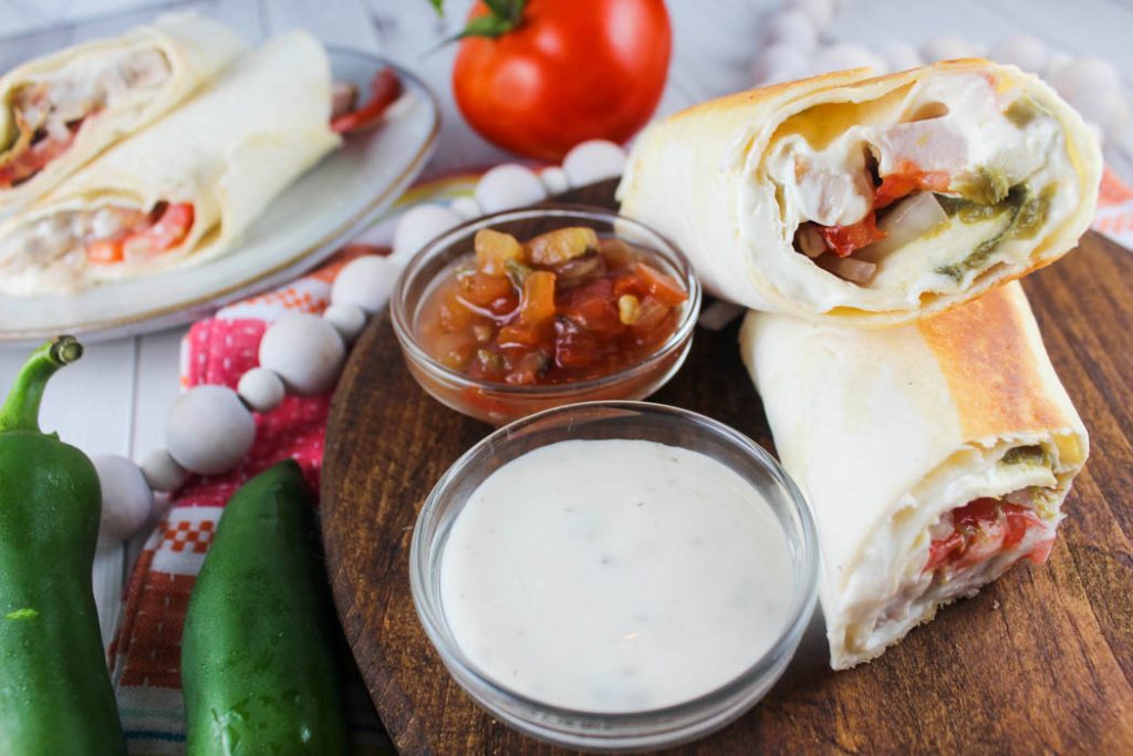This Jalapeno Chicken Wrap is a copycat of my favorite lunchtime treat! Filled with chicken, cream cheese, jalapenos and fresh vegetables! 
