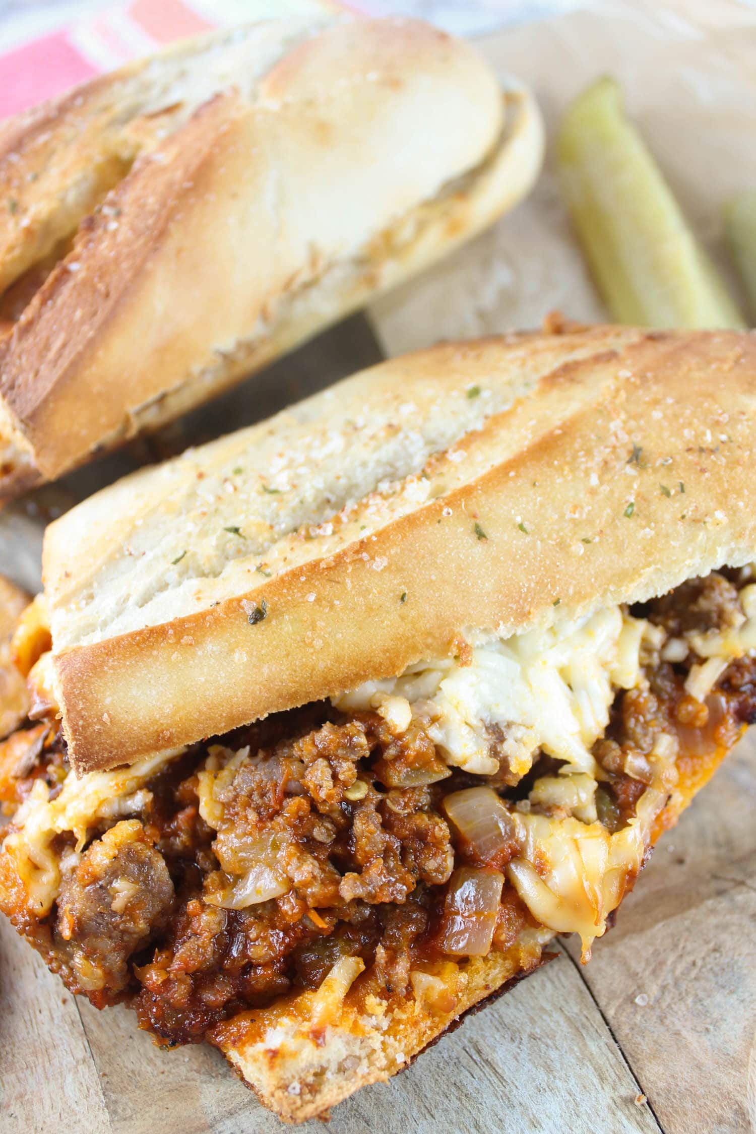 This Italian Grinder sandwich is crunchy, saucy, meaty and cheesy! After one bite, you'll  understand why I love it so much! The recipe is fairly simple - and the number one thing you need is a GOOD Italian sausage - that makes the recipe!  via @foodhussy
