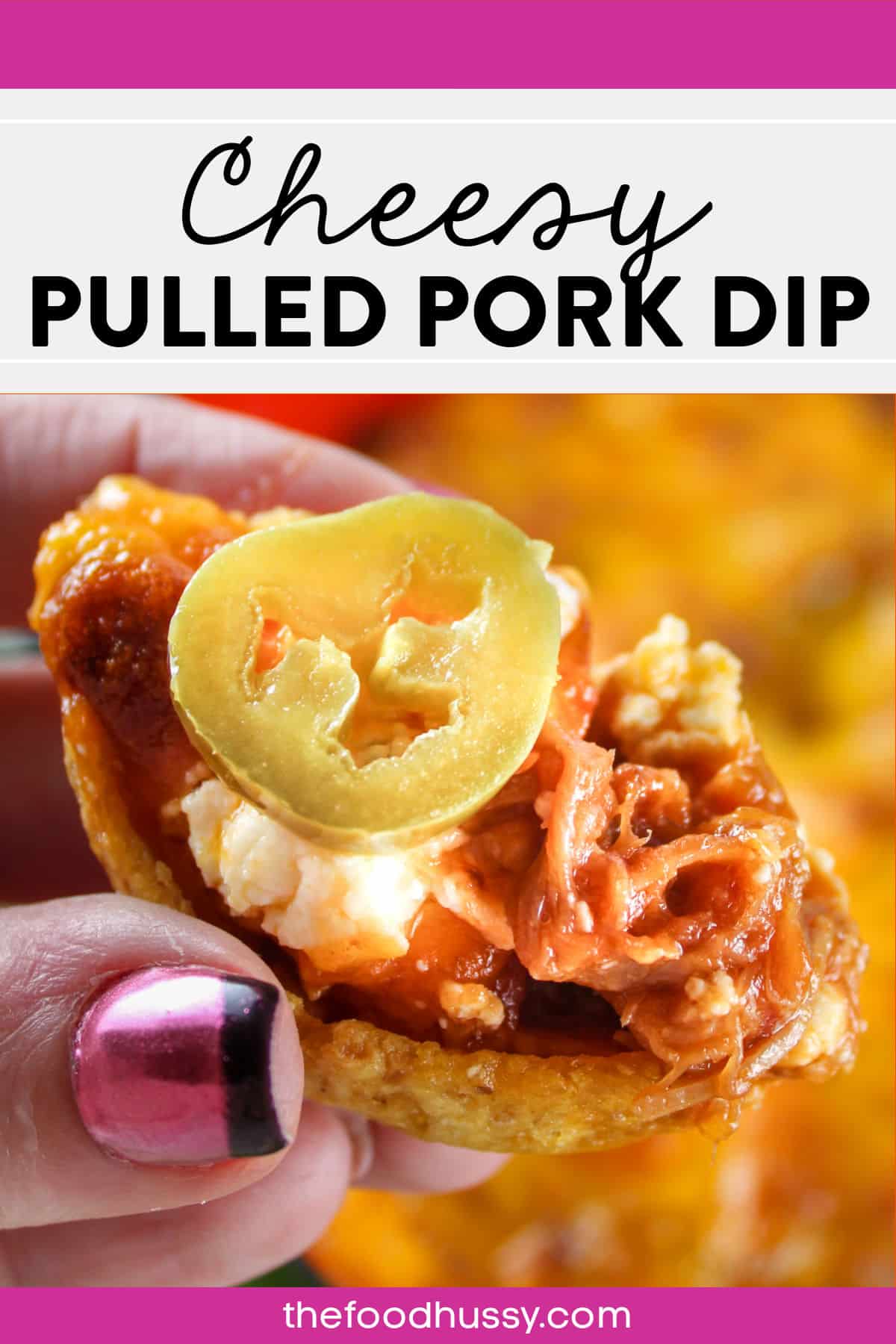 This Cheesy Pulled Pork Dip is delicious and easy to make! Just 5 ingredients and 5 minutes of prep time and you'll have a game day dip that EVERYONE is going to demolish! via @foodhussy