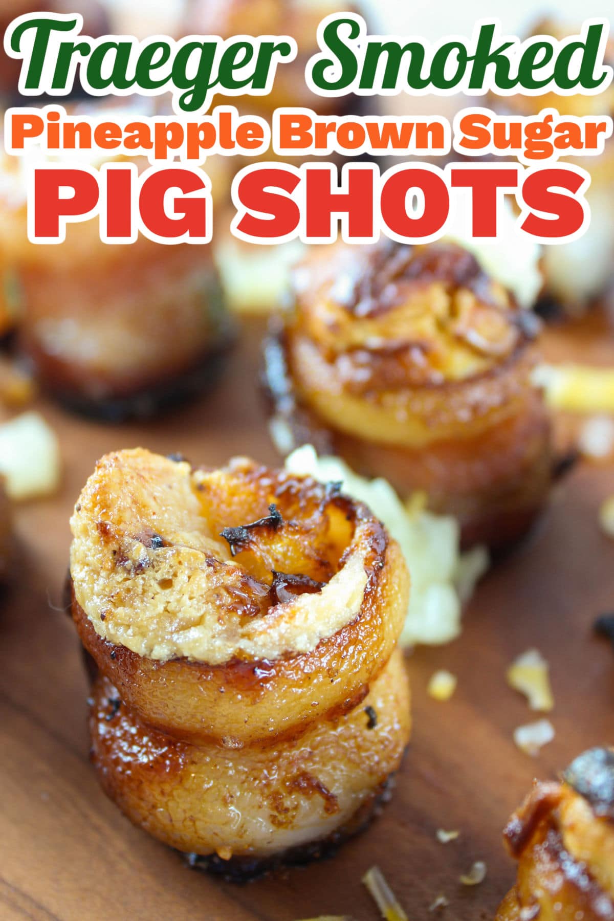 Smoked Pig Shots on the Traeger are the latest and greatest appetizer! Bacon "shot glasses" filled with smoked sausage, cream cheese and more! These are great for any summer barbecue, tailgating or holiday get-together.  via @foodhussy
