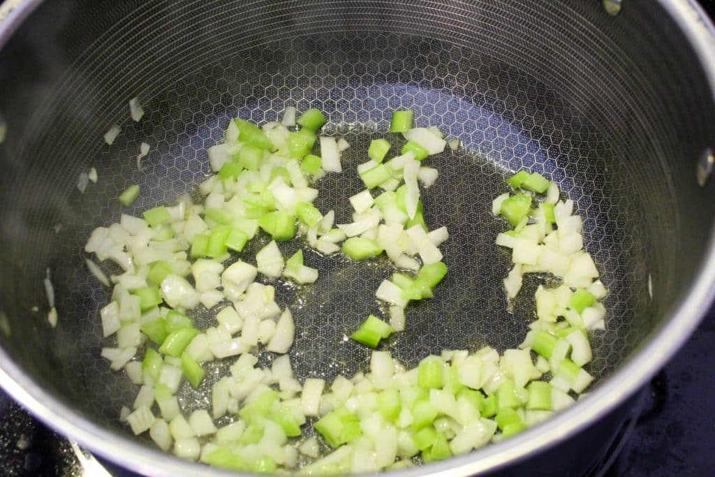 onions and celery in a pot