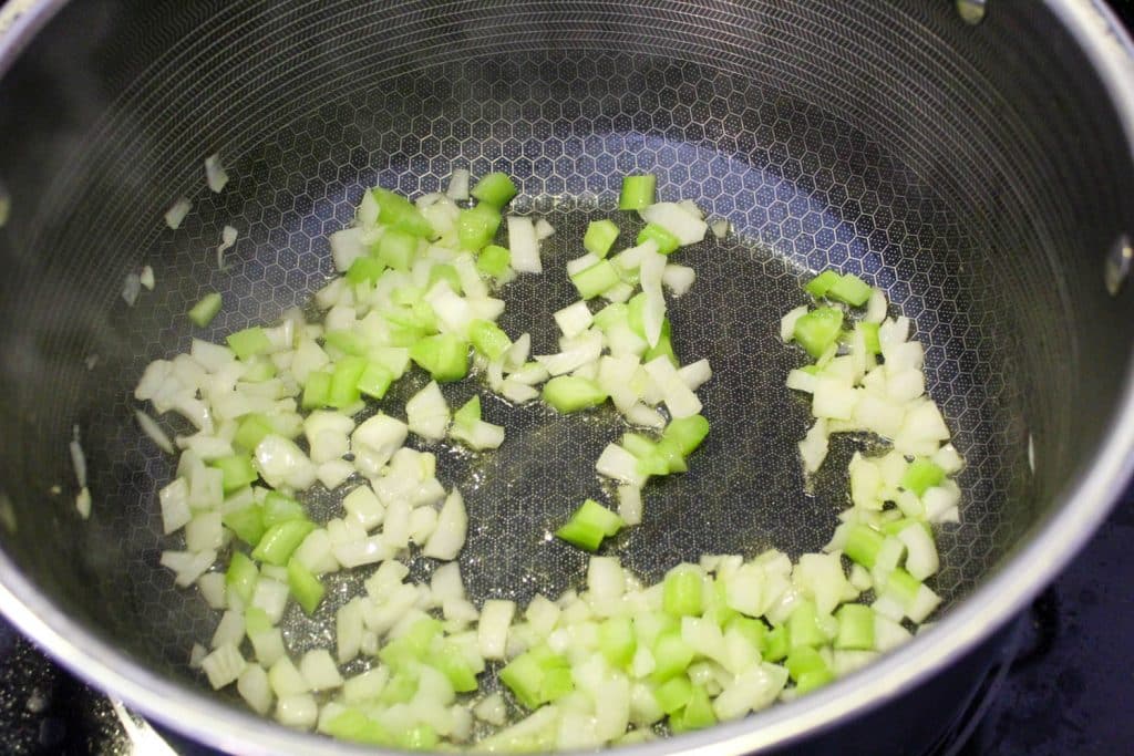 onions and celery in a pot