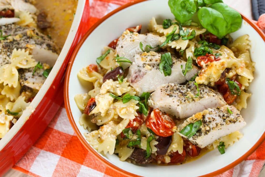 baked feta pasta with chicken in a bowl