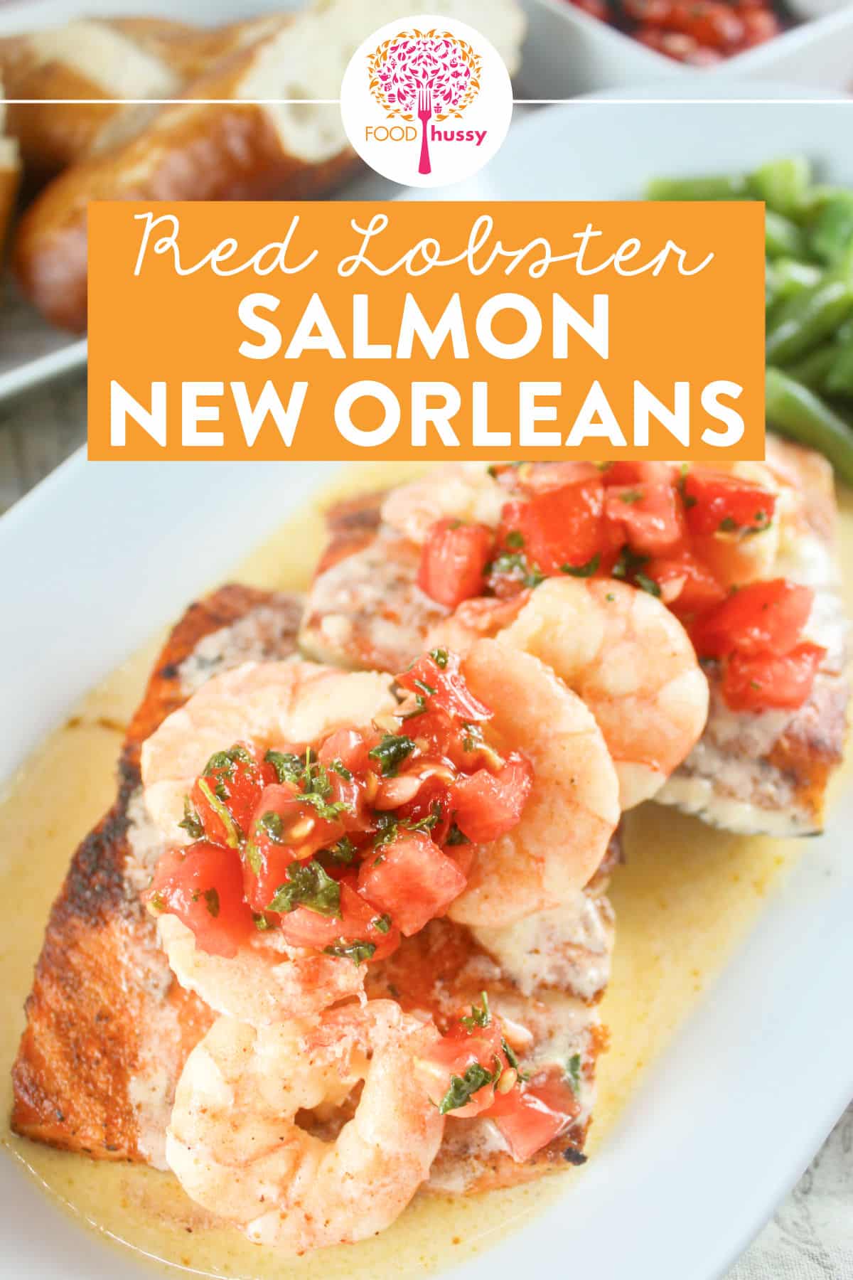 Red Lobster Salmon New Orleans is a delicious dinner choice that features blackened Atlantic salmon topped with shrimp tossed in a Cajun butter sauce, with tomato-cilantro relish. Bonus: it's quick and easy to make at home! via @foodhussy