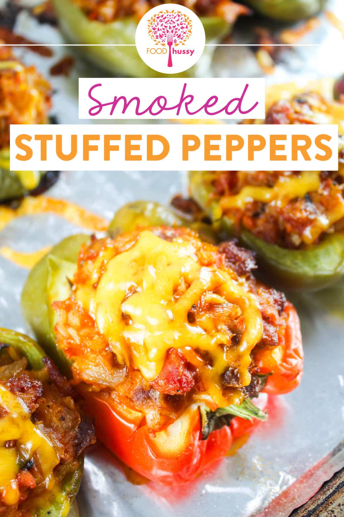 Smoked Stuffed Peppers are my favorite dinner because its a full meal in an edible bowl! Stuffed with sausage, rice, vegetables, rice and cheese - they take on a delicious smoky flavor from the Traeger! via @foodhussy