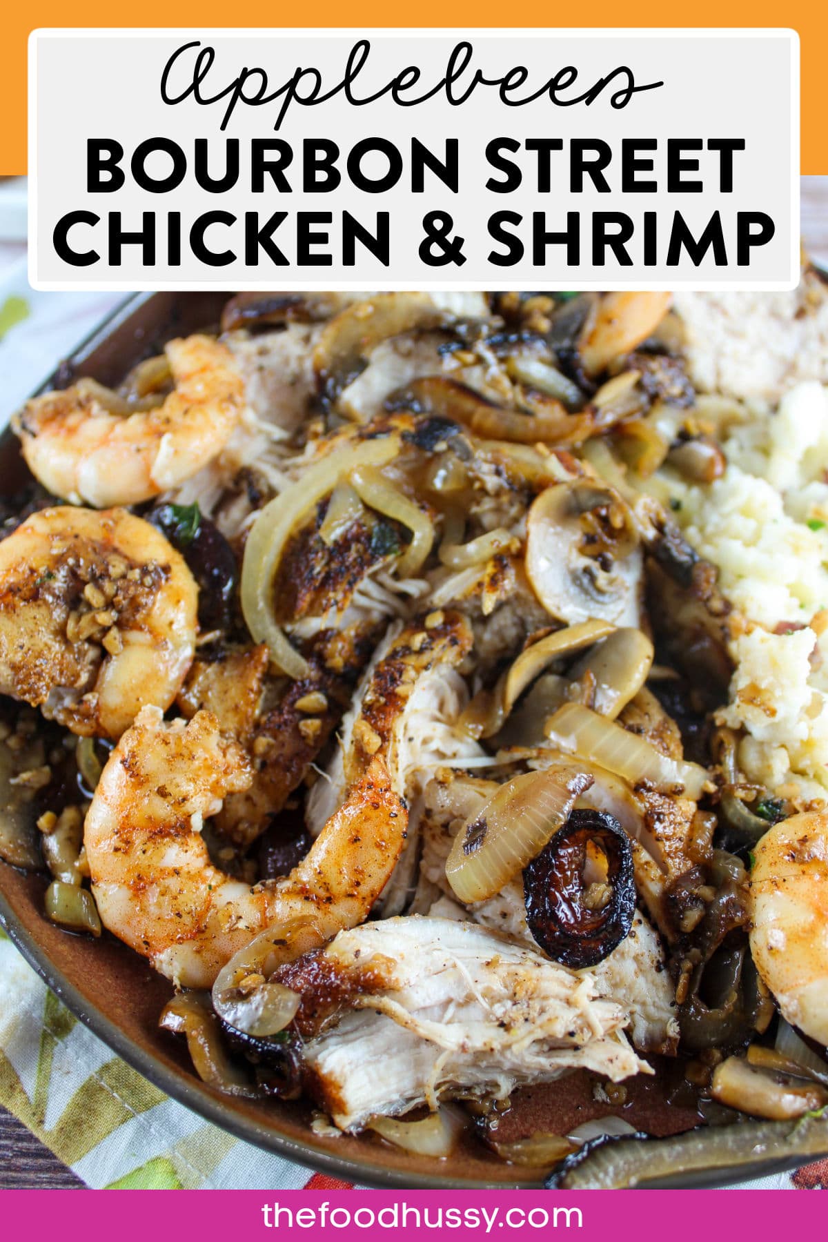 Applebees Bourbon Street Chicken and Shrimp is a sizzling Cajun delight! Cajun-seasoned chicken and shrimp smothered and covered with buttery garlic mushrooms and onions. Serve it like they do with a side of mashed red potatoes! via @foodhussy