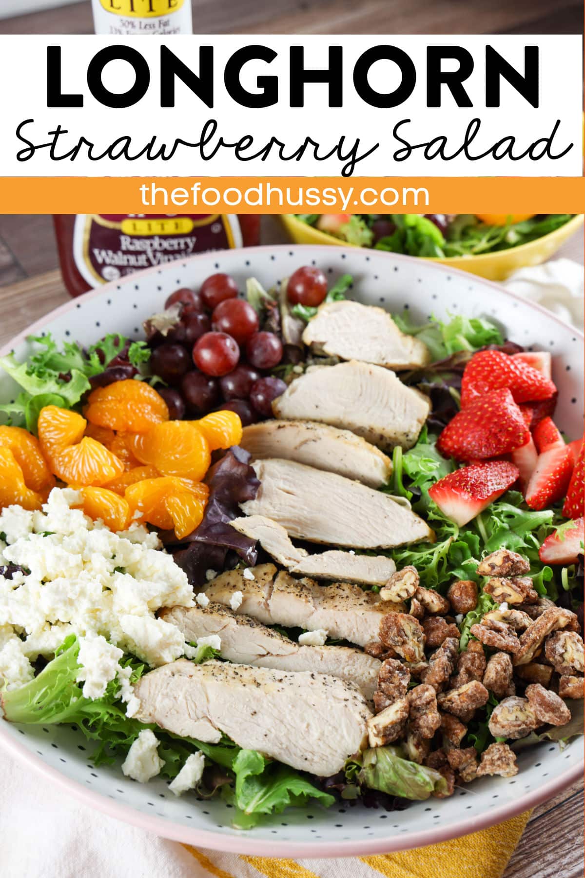 Longhorn Steakhouse Grilled Chicken & Strawberry Salad is a delicious summer salad that you can make at home any time of year! Loaded with grilled chicken, fresh strawberries, red grapes, mandarin oranges, feta cheese and more!  via @foodhussy