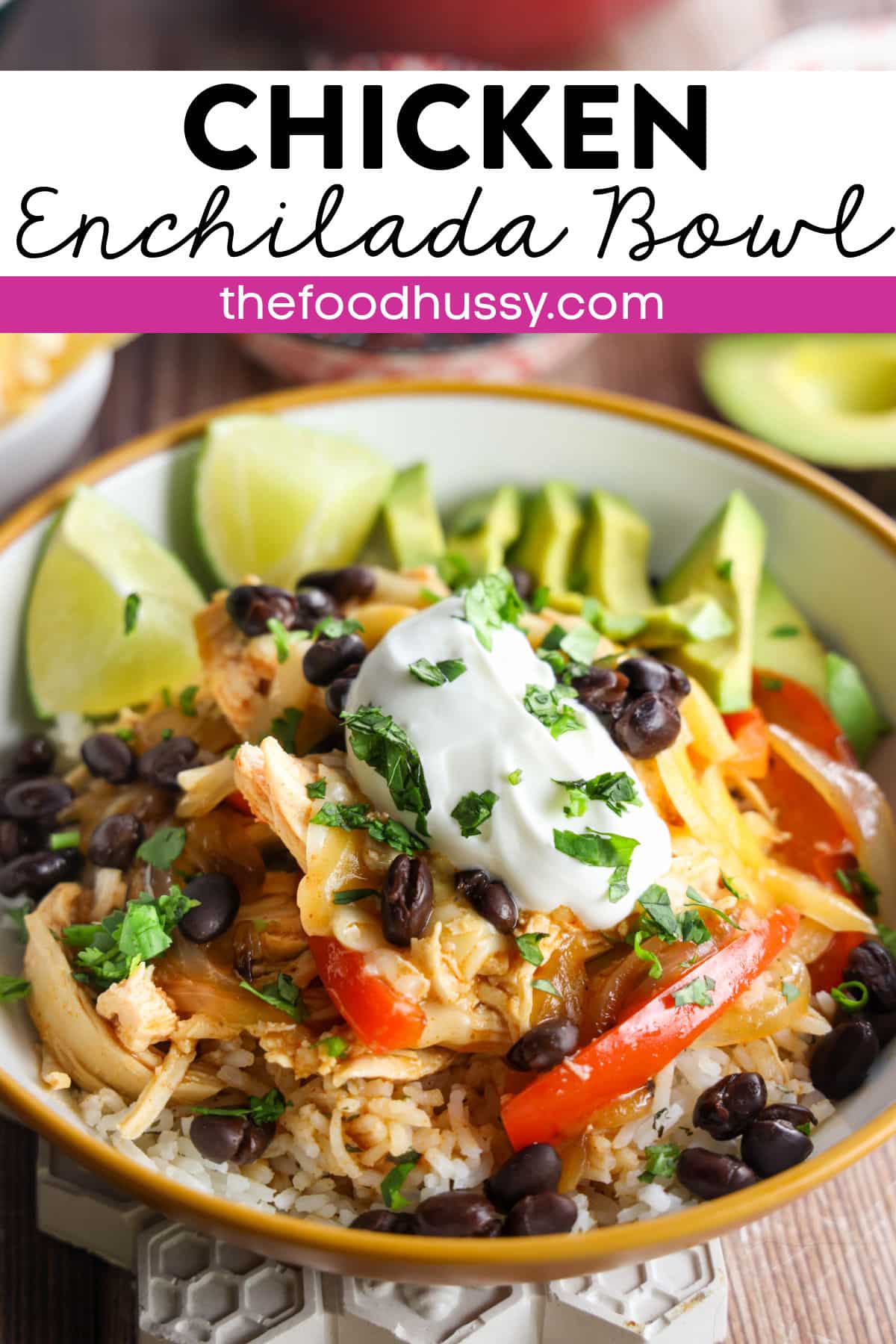 This Chicken Enchilada Bowl features enchilada sauced shredded chicken over a fluffy bed of cilantro lime rice topped with bell peppers, onions and black beans. Topped with melted cheese, avocado, sour cream, fresh cilantro and a hint of lime. It’s a hearty, delicious meal. via @foodhussy