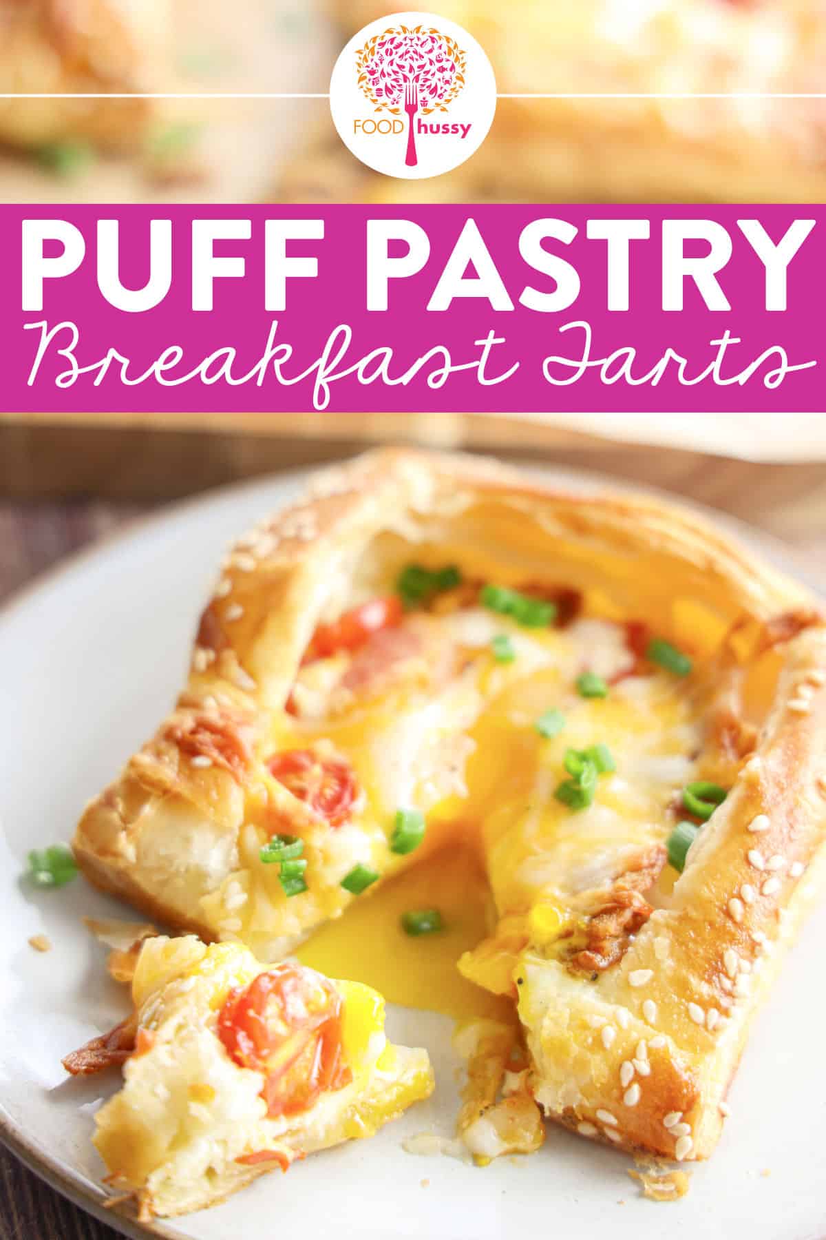 Light flaky puff pastry breakfast tarts will impress any brunch party! They're flaky & crispy then topped with egg, bacon, tomatoes and cheese! This tastes like a perfect breakfast in one slice!  via @foodhussy