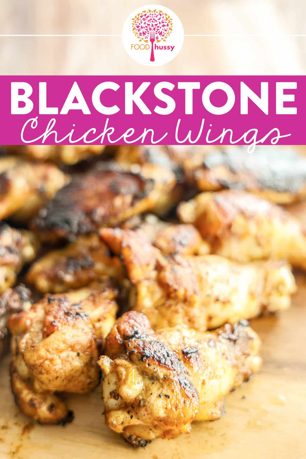 Savor the smoky, charred flavor of juicy chicken wings on the Blackstone griddle! You get a crispy exterior and tender, flavorful meat inside. Toss these Blackstone Chicken Wings in your favorite sauce for a crowd-pleasing delight that brings outdoor grilling to your table! via @foodhussy