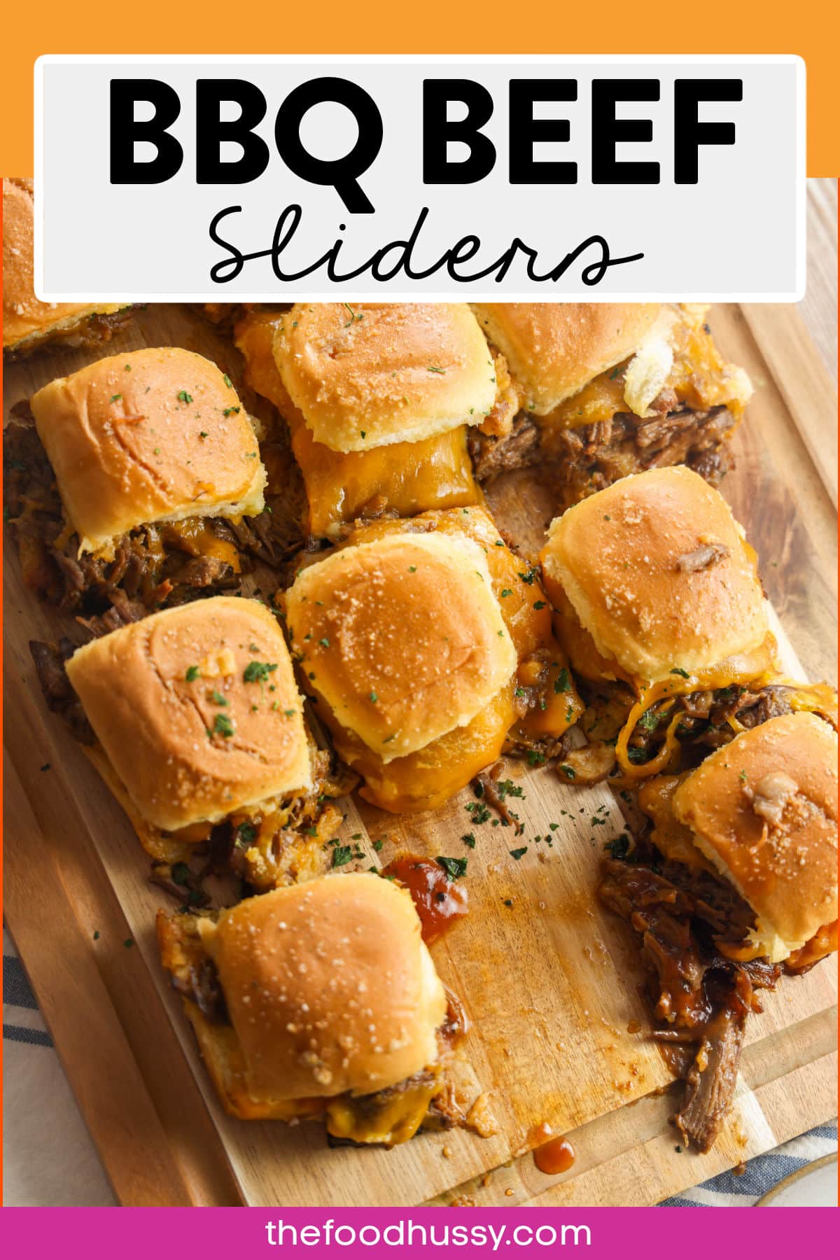BBQ beef sliders are loaded with tender, juicy shredded beef smothered in rich, smoky barbecue sauce and melty cheese served on soft mini buns. These bite-sized delights pack a flavorful punch perfect for any gathering. via @foodhussy