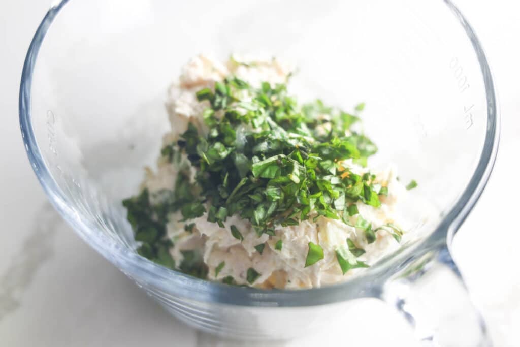 Shredded chicken mixed with mayonnaise, fresh basil, lemon pepper and chopped pecans