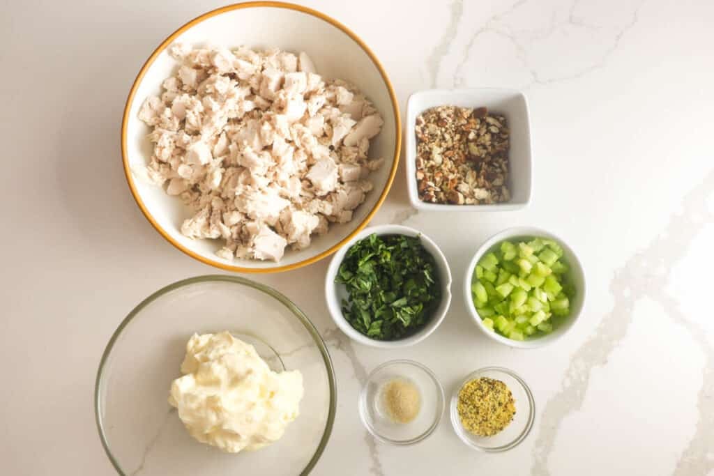 Ingredients for Lauryn's Lemon Basil chicken salad including chicken, basil, lemon pepper, pecans and mayonnaise