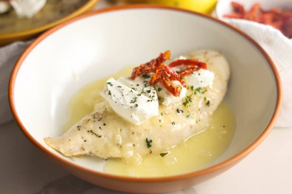 Carrabba's Chicken Bryan with goat cheese, sun-dried tomatoes, fresh basil and lemon butter sauce