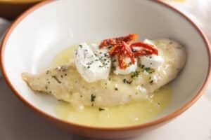 Carrabba's Chicken Bryan with goat cheese, sun-dried tomatoes, fresh basil and lemon butter sauce