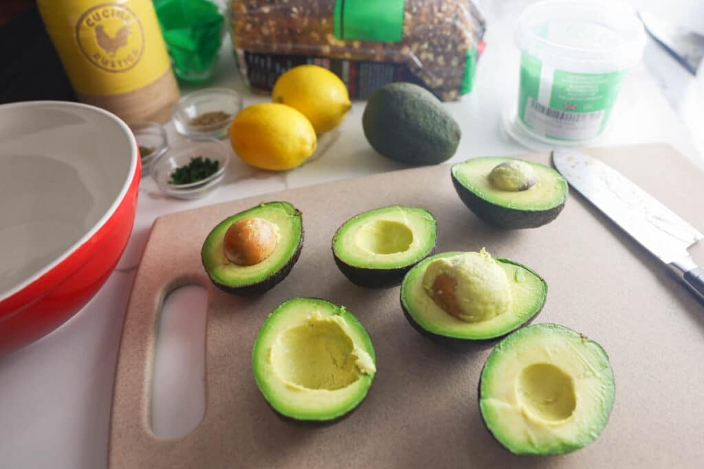 Ingredients for Copycat First Watch Avocado Toast including whole grain bread, avocado, lemon, olive oil, sea salt and eggs.