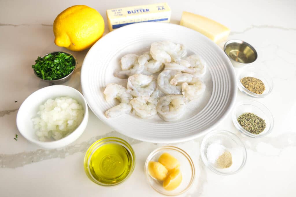 Copycat Carrabba's Shrimp Scampi ingredients: raw shrimp, butter, lemon, garlic, onion, white wine, parsley, Parmesan