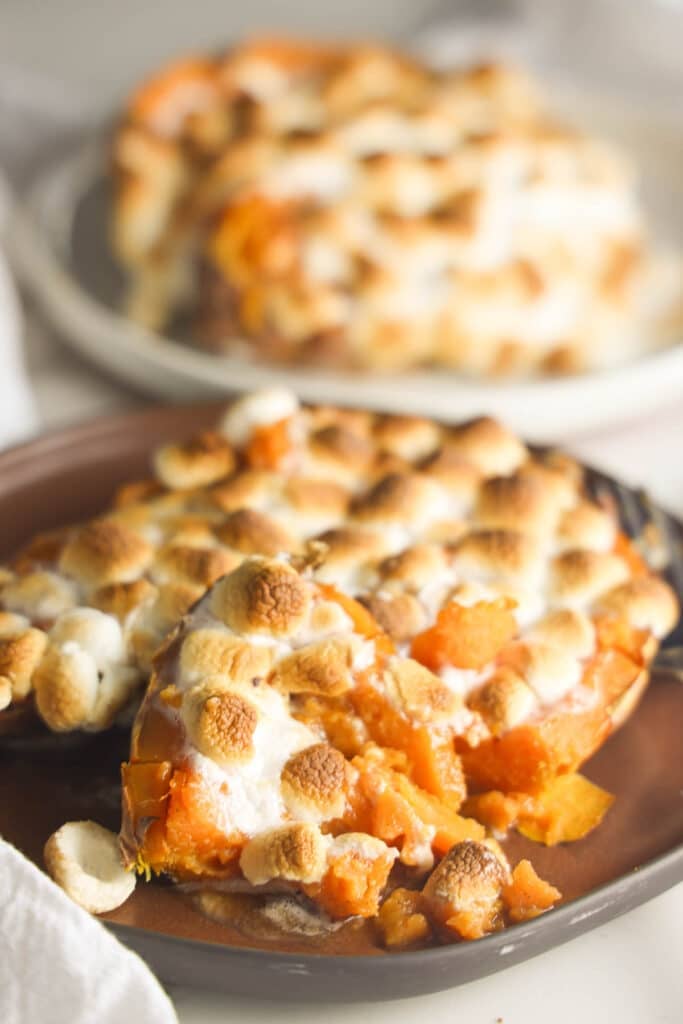 Texas Roadhouse loaded sweet potatoes topped with caramel sauce and toasted mini marshmallows.