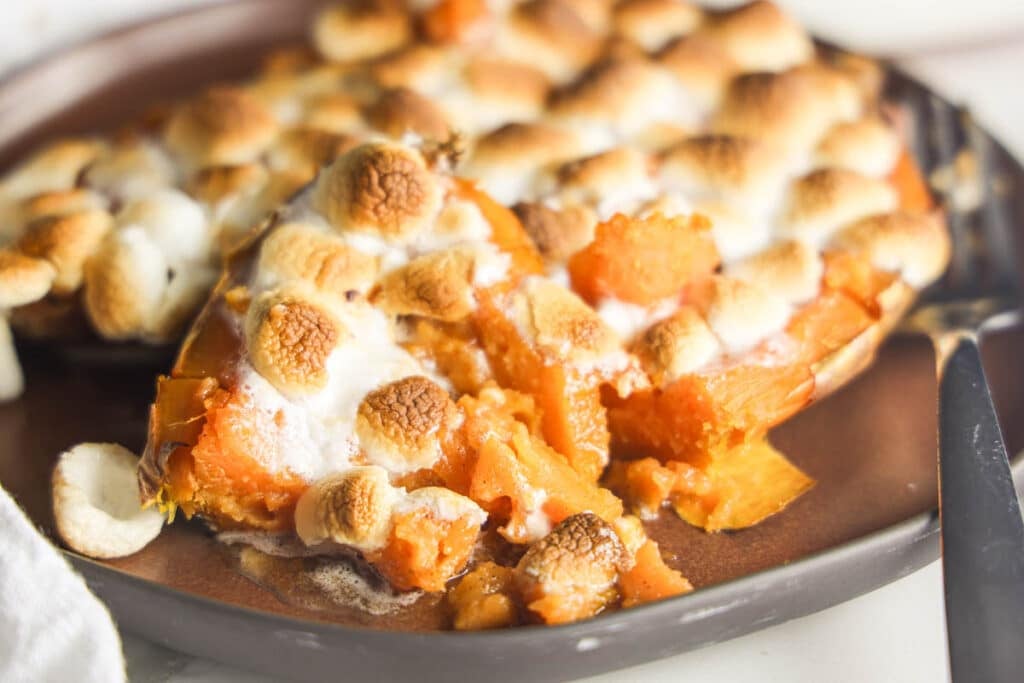 Texas Roadhouse loaded sweet potatoes topped with caramel sauce and toasted mini marshmallows.