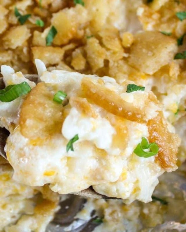 Traeger Smoked Cheesy Potatoes are the perfect side dish for any family meal. Cheesy Potatoes are easy to make and loaded with frozen hash browns, two kinds of shredded cheese, sour cream, diced onion (for a little crunch) and more! #cheesy #potatoes #traeger #easyrecipes #recipeoftheday #foryou