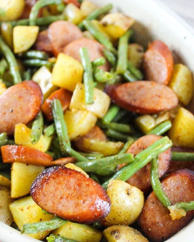 Sausage Green Bean Potato Casserole is the ultimate in a meat and potatoes weeknight dinner! It’s loaded with smoked sausage, seasoned diced potatoes and fresh green beans. #easyrecipes #casserole #foodie #cookingathome #foodblogger