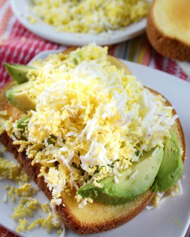 Grated Egg Avocado Toast! I’m not sure why I hadn’t thought to grate a hard boiled egg but I love it! It’s so light and fluffy. It matches well with the creaminess of the avocado and the only seasoning you need is a pinch of coarse salt! #avocado #toast #viral #trending #breakfast #easymeals #recipesforyou