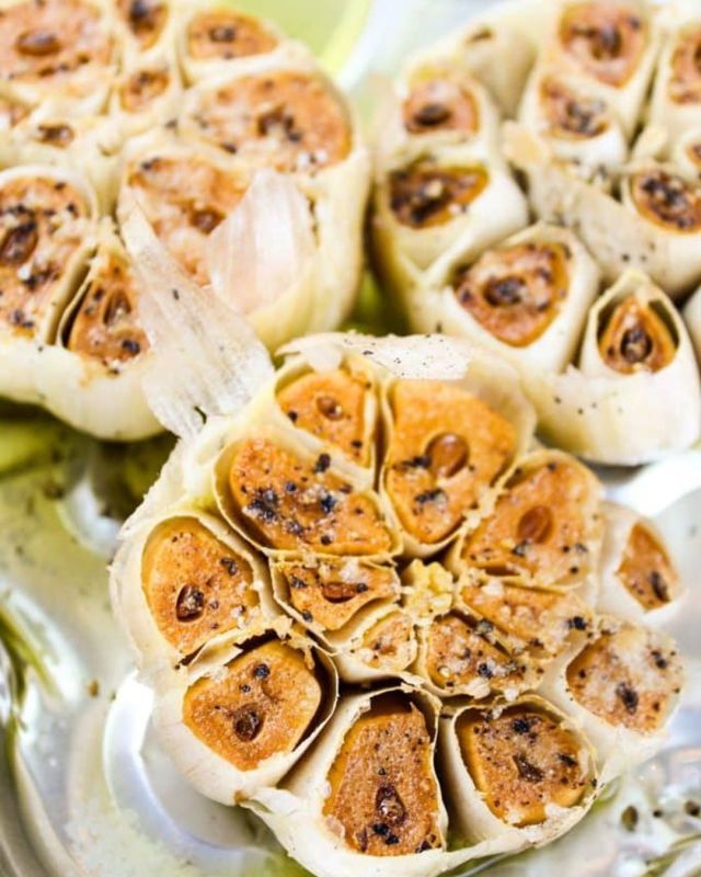 Roasted Garlic is great – but Smoked Garlic takes it to the next level! Smoking gets the garlic soft and smooth, with a mellow flavor – but also adds that touch of smoke that any smoker fan will love! #roastedgaric #garlic #garlicgirl #foodideas #tipsandtricks #howto #foodblogger