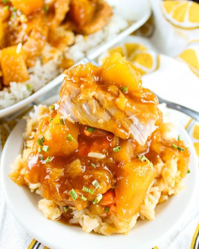Slow Cooker Hawaiian Pork Chops are a family favorite! Tender boneless pork chops coated in a thick sweet & sour sauce with juicy chunks of pineapple.  #slowcooker #crockpot #porkchops
