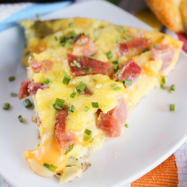 This easy Cheese and Ham Frittata is my favorite dish for brunch. Loaded with Ham & Colby Jack cheese - it's great for holiday leftovers or when you've got family over! https://buff.ly/47te3od #frittata #brunch #egg #ham #cheese
